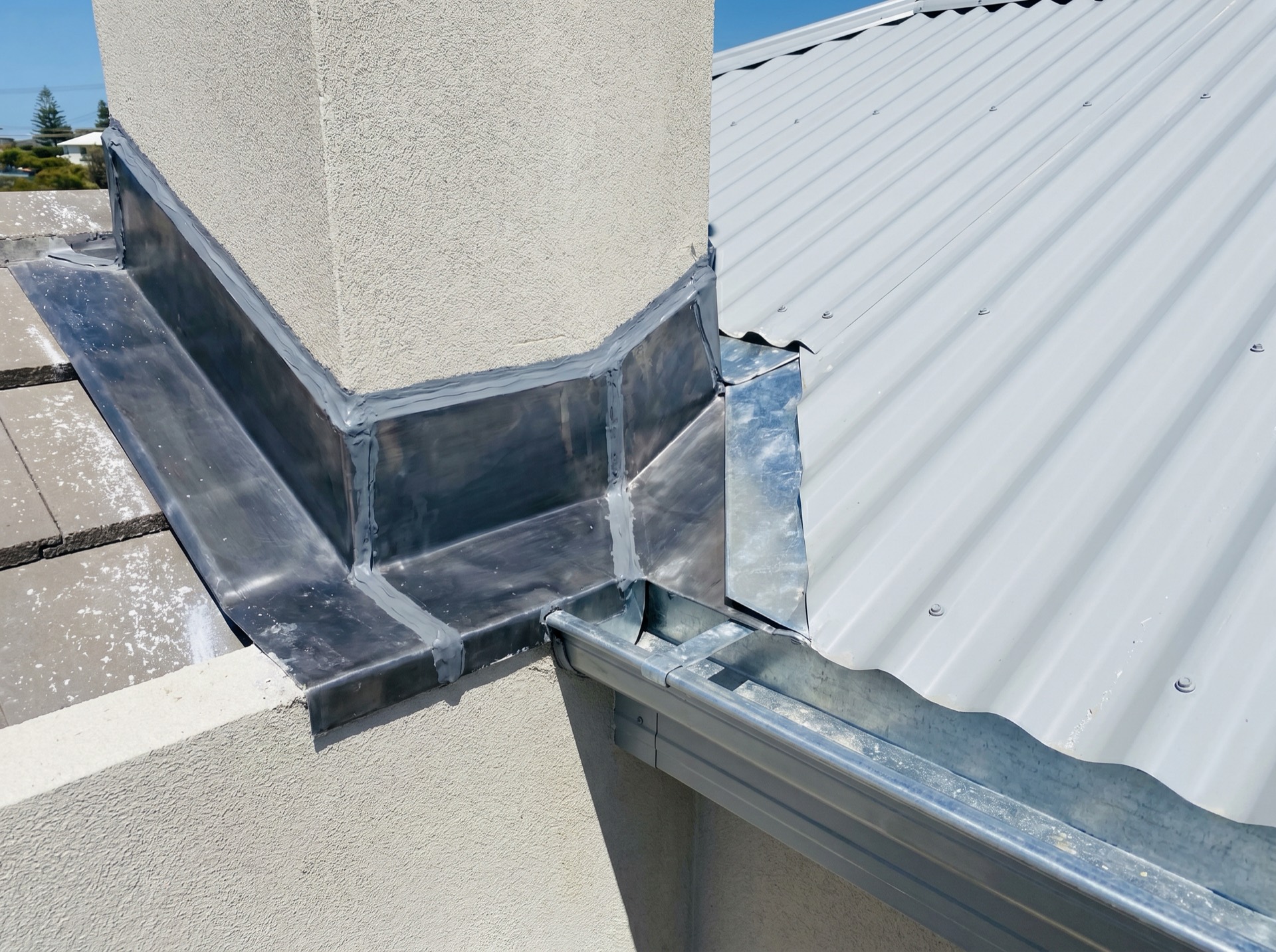 New gutter, valley iron and lead flashing detail on a coastal roof